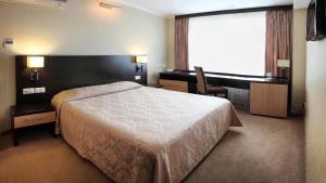 Cama o camas de una habitación en Vega Hotel