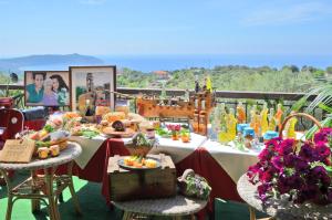 a table with food and other items on it at Villa delle Muse da Imma in Palinuro