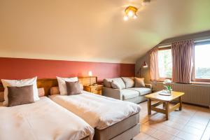 Postel nebo postele na pokoji v ubytování A la ferme du Pere Eugene