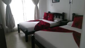 Voodi või voodid majutusasutuse Hotel Colonial toas