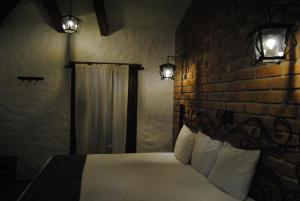 Säng eller sängar i ett rum på Hotel Casa Índigo