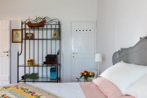 a bedroom with a bed and a door at La Baita in Gardone Riviera