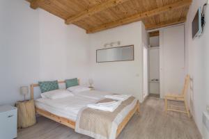 Postel nebo postele na pokoji v ubytování Casa Stavros