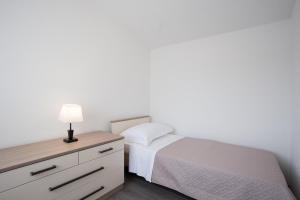 Postel nebo postele na pokoji v ubytování Jela Apartment