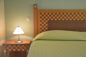 Кровать или кровати в номере Emporios Bay Hotel Chios