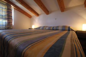 Postel nebo postele na pokoji v ubytování Apartments Macolic