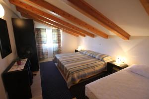 Postel nebo postele na pokoji v ubytování Apartments Macolic