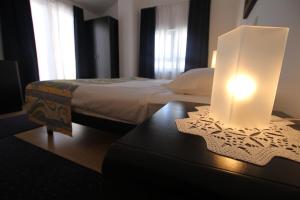 Postel nebo postele na pokoji v ubytování Apartments Macolic