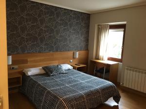 Postel nebo postele na pokoji v ubytování Hotel Errekagain