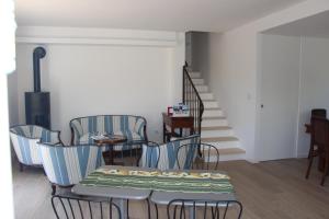 a dining room with chairs and a table and stairs at B&B Bessy 10 in Antibes