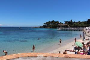 a group of people on a beach in the water at B&B Bessy 10 in Antibes