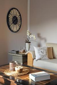 a living room with a couch and a coffee table at Ferienwohnung Maarland in Schalkenmehren