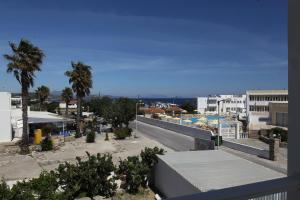 a view of a city with palm trees and a skate park at Antonis Hotel in Kefalos