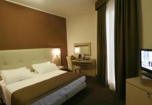 Postel nebo postele na pokoji v ubytování Hotel Vittoria + 37 fotografií