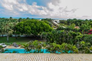 an aerial view of a resort with a swimming pool at Refúgios Parajuru - Villa Cristiano in Parajuru