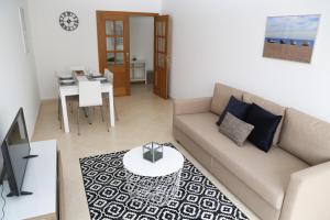 Un lugar para sentarse en Da Ponte Flats - Armacao De Pera Blue Apt.