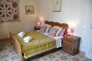 Cama ou camas em um quarto em Case Bruno Residenze Tipiche