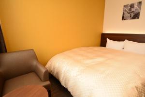 Postel nebo postele na pokoji v ubytování Hotel Sunroute Sano