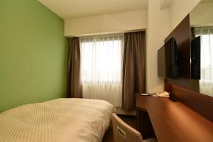 TV a/nebo společenská místnost v ubytování Hotel Sunroute Sano