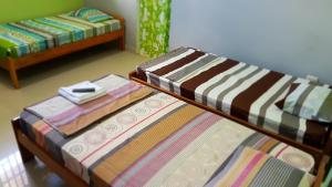 a bed in a room with a bed sidx sidx sidx at Hospedaje Mas in Tarapoto
