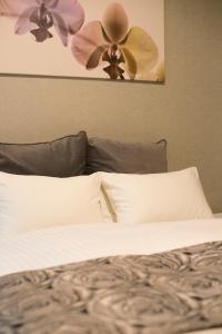 a bedroom with a bed with two ceiling fans at Residence Hotel Hakata 3 in Fukuoka +21 photos