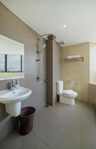 a bathroom with a sink and a toilet at Riccarton Capsule Hotel in Kuala Lumpur