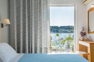Postel nebo postele na pokoji v ubytování Hotel Akti