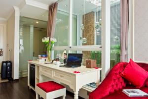 a room with a desk with a laptop on it at Luxury Old Quarter Hotel & Gym in Hanoi