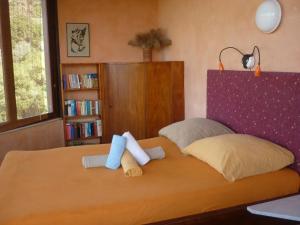 A bed or beds in a room at The Place by the Sun