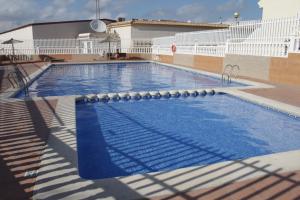 a large swimming pool on top of a building at Appartement 179 in Gran Alacant