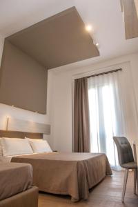 Posteľ alebo postele v izbe v ubytovaní I Cordari B&B