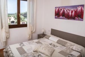 Säng eller sängar i ett rum på Villa Rosanna