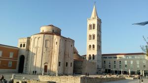 an old building with a tower and a church at Sea view apartman Antonio in Zadar