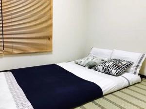 東京宜克布克羅塔卡哈斯米斯余克別墅房間的床