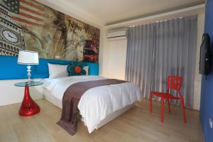 Postel nebo postele na pokoji v ubytování Guo Chen Hotel + 27 fotografií