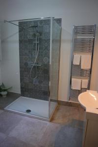 a shower stall in a bathroom with a sink at Alla Marina Bed And Breakfast in Trapani