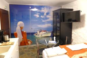 a kitchen with a window with a view of a boat at Anastasia Luxury Villas in Gavrio