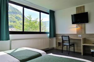 En eller flere senger på et rom på Jura Hotel Restaurant Le Panoramic