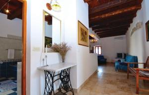 a living room with a table in the middle of a room at Holiday House Ivana in Dobropoljana