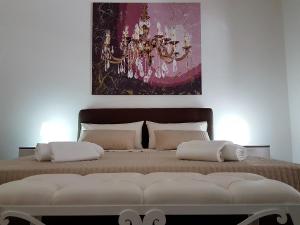 Łóżko lub łóżka w pokoju w obiekcie NoMapartments Il Viaggiatore