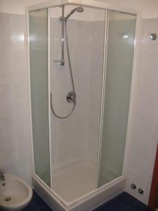 a shower with a glass door in a bathroom at Residence Borgo San Sebastiano in Bergeggi +26 photos