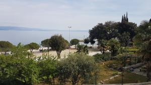 a view of a park with the ocean in the background at Apartments Opatija-Ičići in Ičići