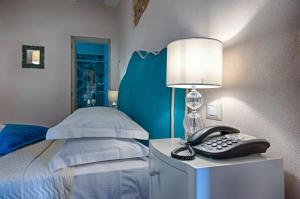 A bed or beds in a room at Antica Quercia Villa & Spa