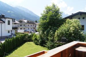 a view from the balcony of a house with a yard at Appartement Perauer in Mayrhofen
