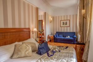 Postel nebo postele na pokoji v ubytování Albergo Ottocento