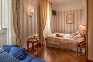 Postel nebo postele na pokoji v ubytování Albergo Ottocento
