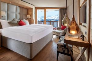 Postel nebo postele na pokoji v ubytování Chandolin Boutique Hotel