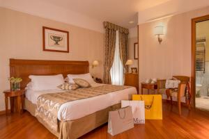 Postel nebo postele na pokoji v ubytování Albergo Ottocento