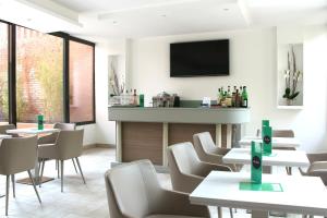 TV a/nebo společenská místnost v ubytování Hotel Executive