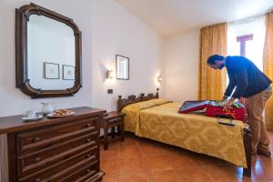 Voodi või voodid majutusasutuse Hotel Il Querceto toas